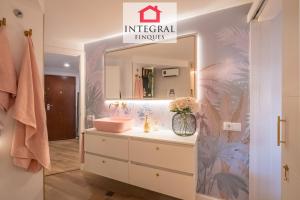 a bathroom with a sink and a mirror at Les Palmeres Palamós in Palamós +14 photos
