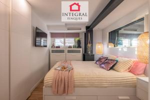 a bedroom with a bed with a tray on it at Les Palmeres Palamós in Palamós