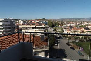 a view of a city from a balcony at Signature city loft in Tríkala +2 photos