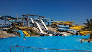 a large water park with a water slide at "Da Carla e Sandro"- Appartamento con parcheggio privato in Quartucciu