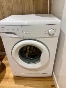 a white washer and dryer in a room at Apartment Ela Centre in Košice