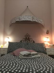 a bedroom with a large bed with two night stands at La Maison Sabina in Passo Corese +10 photos