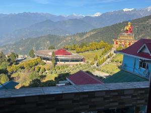 a view of a building with a statue on top of it at Karma homestay in Ravangla