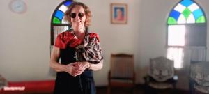 a woman wearing sunglasses standing in a room at Anna's Heritage bungalow in Alleppey
