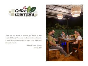 a group of people sitting at a table at Coffee Courtyard - Boutique Estate Retreat, Coorg in Kurchi +32 photos