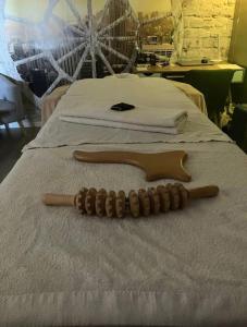 two baseball bats sitting on top of a bed at Bella Vista Cabris in Cabris