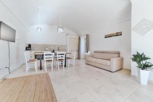 a living room with a couch and a table at Dimora Stune in Ostuni