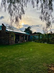 a house with a large lawn in front of it at 14 Mirage crescent in Welkom