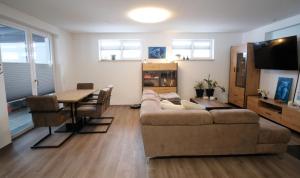 a living room with a couch and a table at Ferienwohnung Lerchenstraße in Schwerin