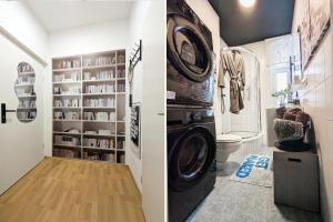 a bathroom with a washer and dryer in a room at City Pension in Reichenbach im Vogtland