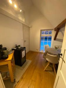 an empty living room with a table and a window at Frihmess in Bensheim +21 photos