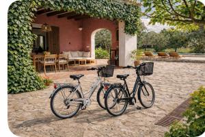 two bikes parked in front of a house at Villa Es Puig, piscina y vistas a la montaña in Santa Margalida