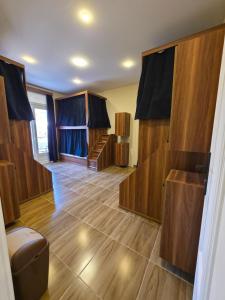 a room with wooden floors and a room with a toilet at Swisstay Downtown Cairo in Cairo