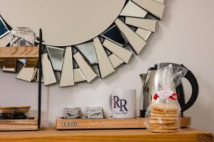 a shelf with a coffee mug and a plate of bread at Rosie's Rest in Hunstanton