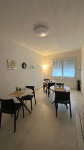 a dining room with tables and chairs and a window at Borgo San Michele Bed & Breakfast in Calvisano