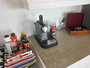 a kitchen counter with a coffee maker on a counter top at The Windsock in Ballito