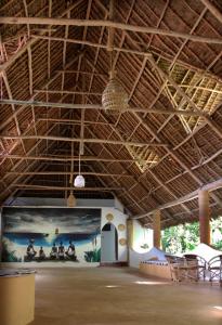 a large room with a large painting on the wall at VeriDiana Hotel Zanzibar in Dimbani