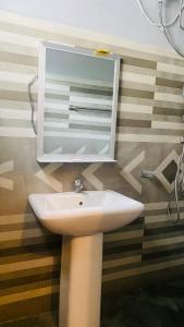 a bathroom with a sink and a medicine cabinet at Ocean Breeze in Dickwella +52 photos
