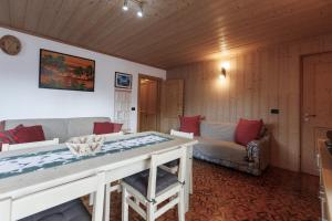 a living room with a couch and a table at Chalet Beppe in Bormio