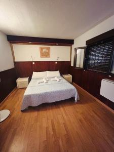 a bedroom with a bed with two towels on it at Neptuno 12 in Caleta De Fuste