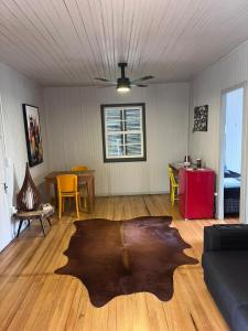 a living room with a large rug on the floor at Garibaldi Guest House in Garibaldi