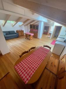 a living room with a table and a couch at Openspace in legno La Casa sull'Albero in Osimo