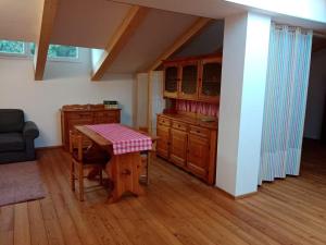 a kitchen with a wooden table and a dining room at Openspace in legno La Casa sull'Albero in Osimo