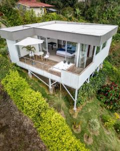 an overhead view of a house with a porch at Glamping Jalisco in Buenavista