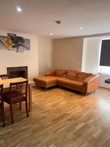 a living room with a couch and a table at Regent Hotel in Eastbourne
