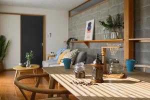 a wooden table in a living room with a tableablish at Aso Vista in Aso