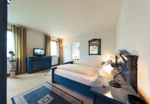 Postel nebo postele na pokoji v ubytování Garni-Hotel An der Weide