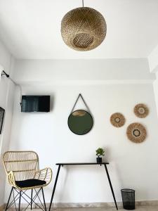 a dining room with a table and a chair at LaMar in Skala Prinou