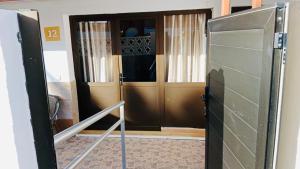 an entrance to a room with a door open at Neptuno 12 in Caleta De Fuste