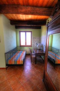 Łóżko lub łóżka w pokoju w obiekcie Azienda Agrituristica Alcastlè