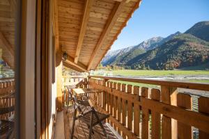 a balcony of a house with a view of the mountains at Garnì dal Mozat in Ledro