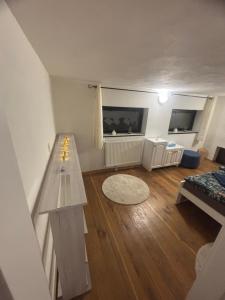 a living room with a bench and a table at Holiday loft U Kotynku in Veselí nad Lužnicí