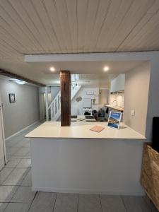 a kitchen and living room in a house at Calm guest house in Clerval +11 photos