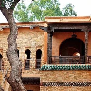 a building with a tree in front of it at Majestic Room in Agadir