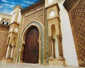 an entrance to a building with a large wooden door at Majestic Room in Agadir