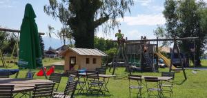 a park with a playground with tables and chairs at Stefanutti-Hof in Grabenstätt