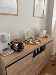 a wooden counter with cupcakes on top of it at La Terraza de Sovega in Arenas de Cabrales