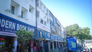 a group of signs on the side of a building at Hotel Majestica 22 in Chandīgarh