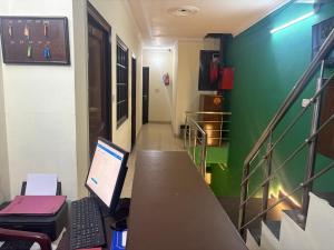 an office with a desk with a computer on it at Hotel Majestica 22 in Chandīgarh