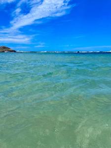 a view of the ocean from the beach at CAIPORA Hostel Lagoa in Saquarema