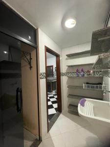a bathroom with a toilet and a sink in it at CAIPORA Hostel Lagoa in Saquarema +27 photos