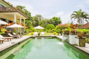 an image of a swimming pool in a villa at Bukit Asri Lodge in Seraya