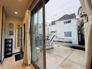 a room with a window with a view of a street at SnowMapleHouse西川口 in Kawaguchi