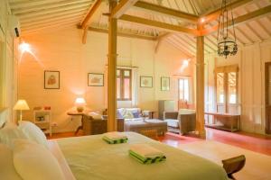 a living room with a bed in a room at Bukit Asri Lodge in Seraya +88 photos