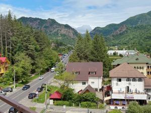 a small town in the mountains with a road at Casa Obstei Caciulata in Caciulata