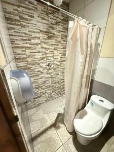 a bathroom with a toilet and a shower at Cristales de Antigua Casa Cristal in Antigua Guatemala +55 photos